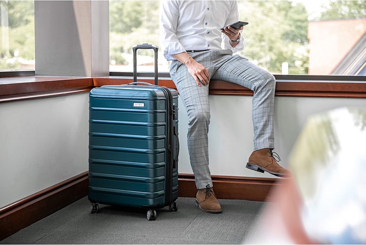 Samsonite freeform in green man in professional attire next to it