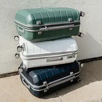 Three Freeform suitcases stacked