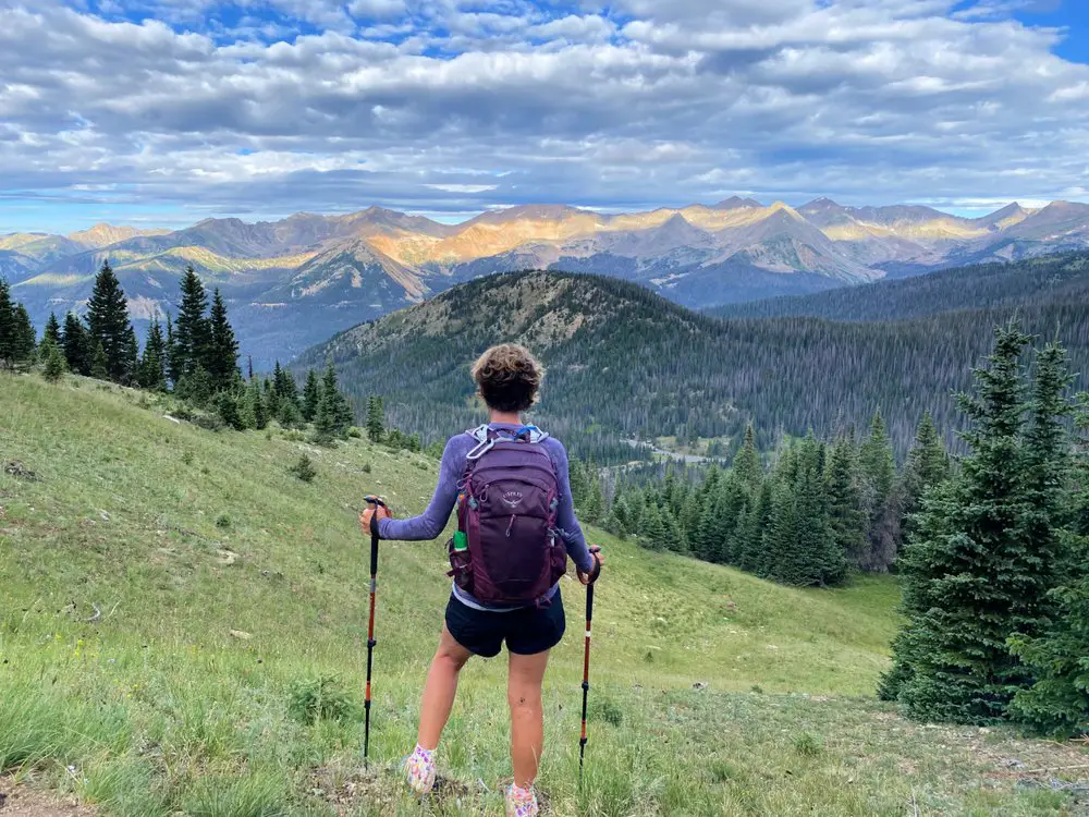woman trekking with gorgeous background vistas