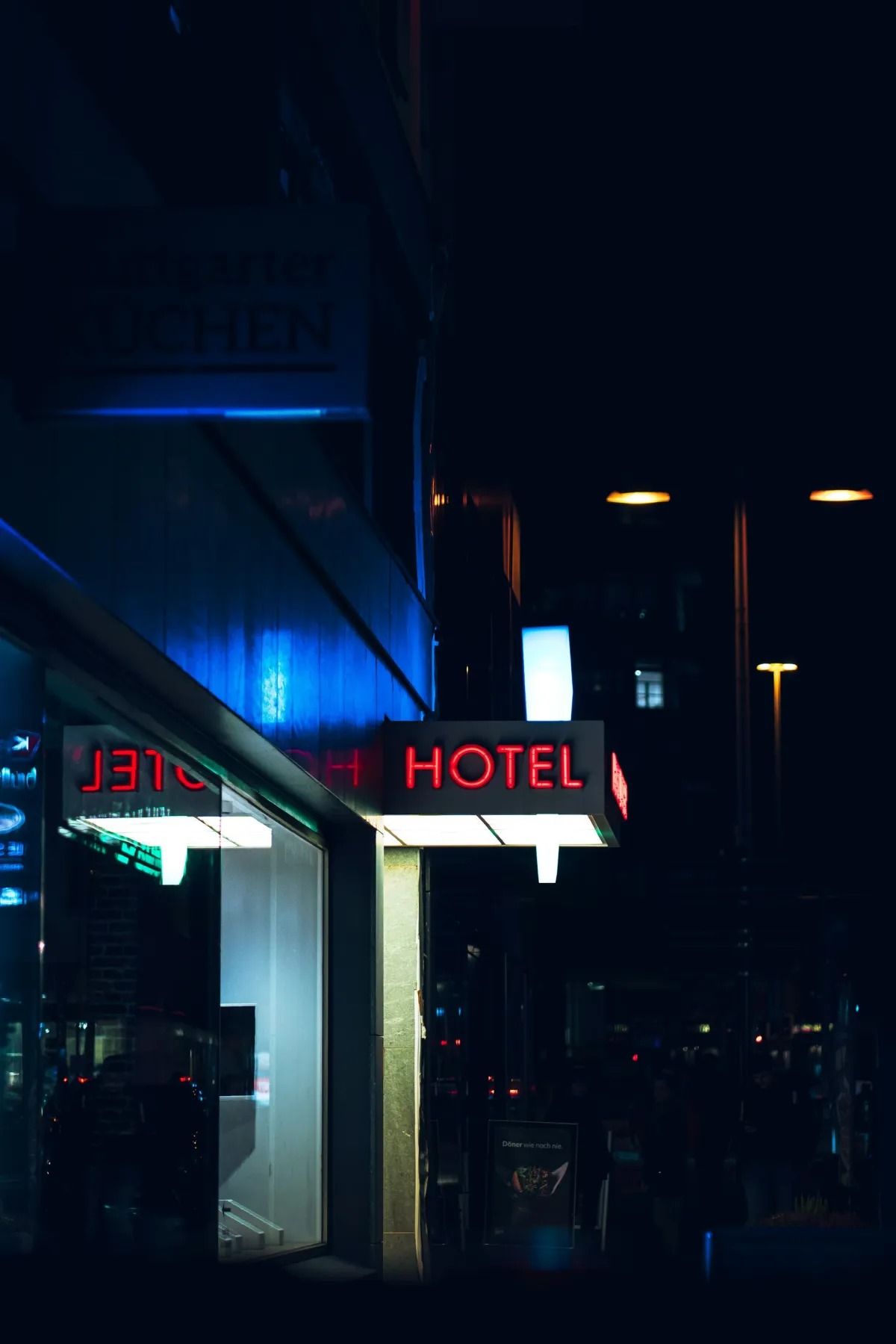 Hotel sign lit up at night for late check-in guide