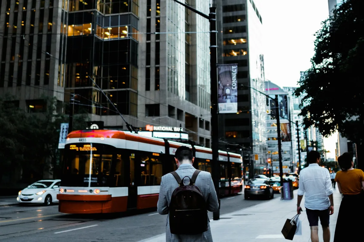 Professional commuter walking with a laptop backpack