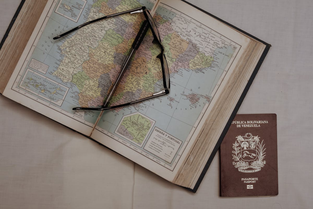 Travel wallet with passport and boarding pass on a map