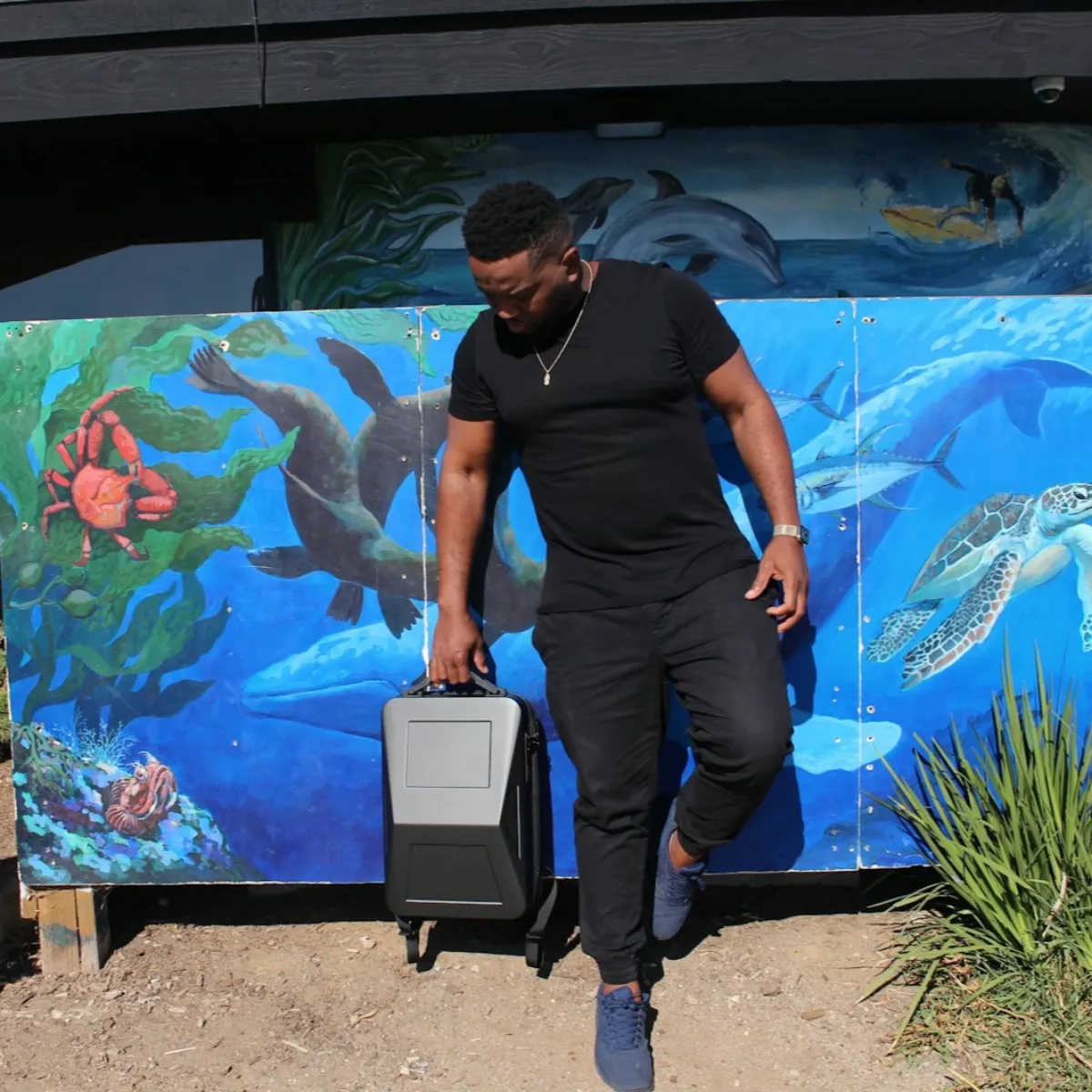 Modern anti-theft hardshell laptop backpack with a slim, lockable profile designed for urban travel.