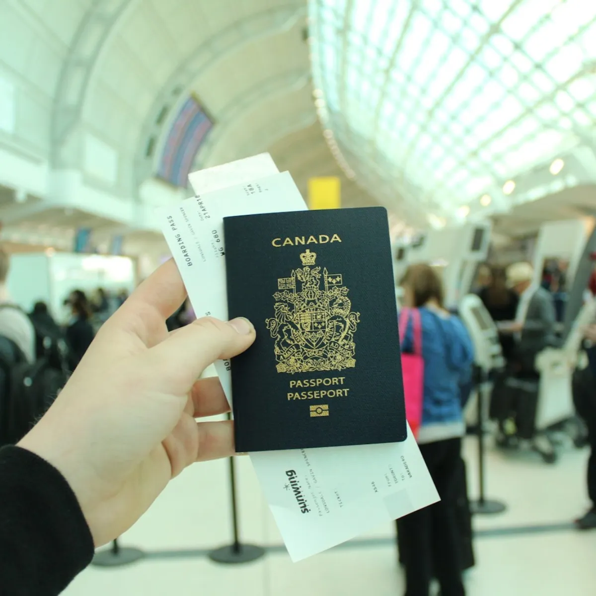 Traveler pulling out a passport at an airport checkpoint moment
