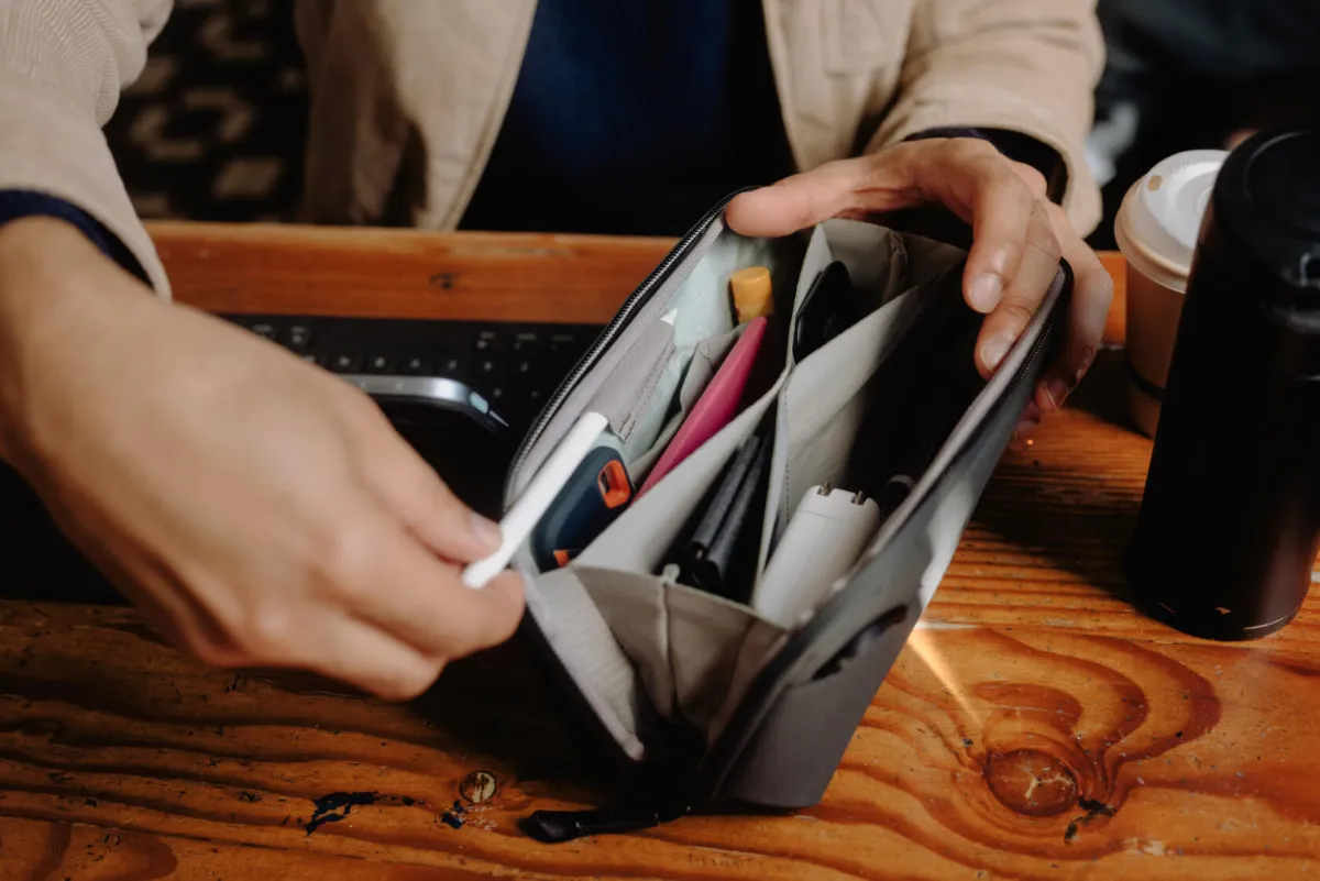 Peak Design Tech Pouch opened flat showing origami-style interior pockets organizing tech gear