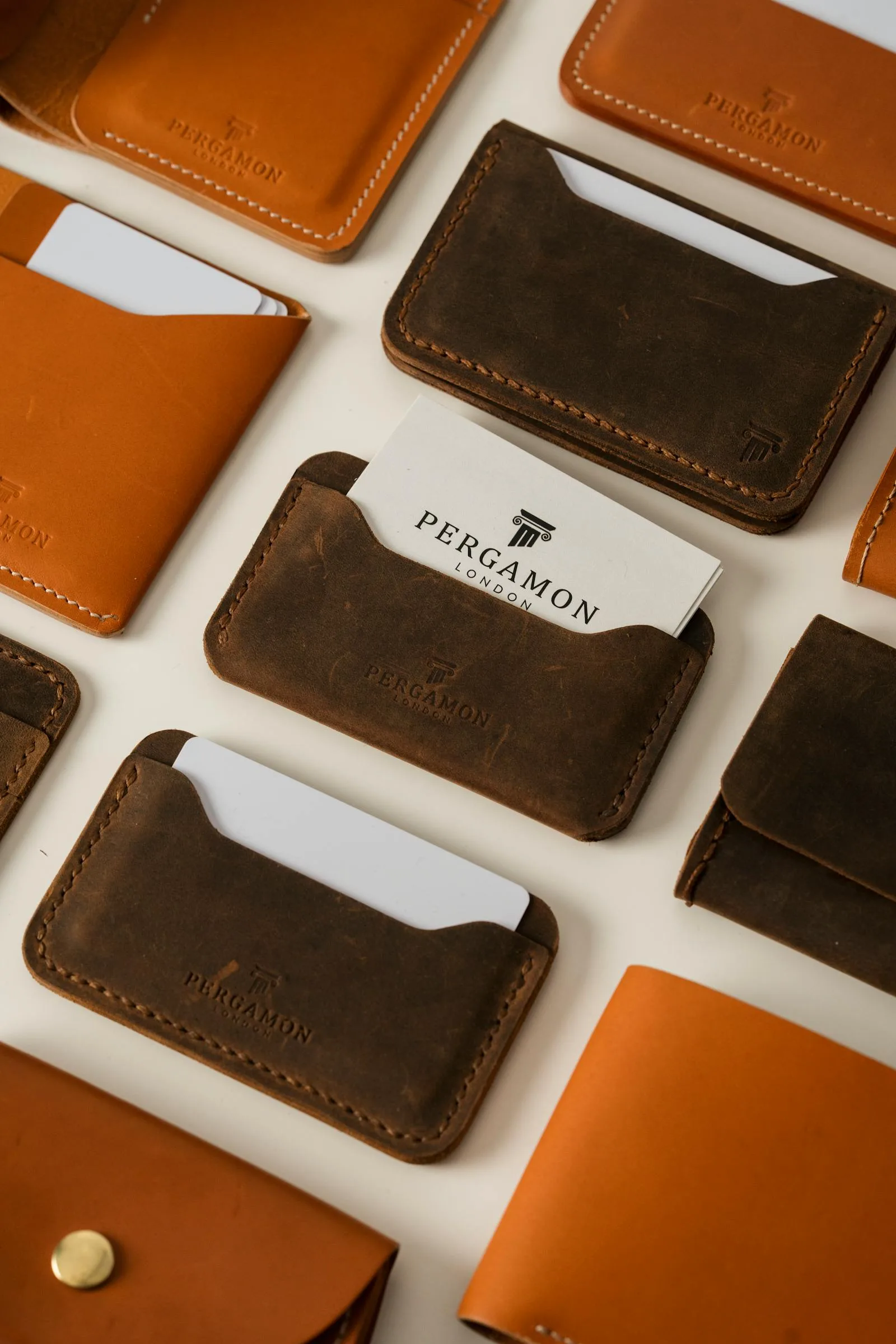 Assorted leather wallets and card holders displayed in a flat layout, showcasing quality craftsmanship.