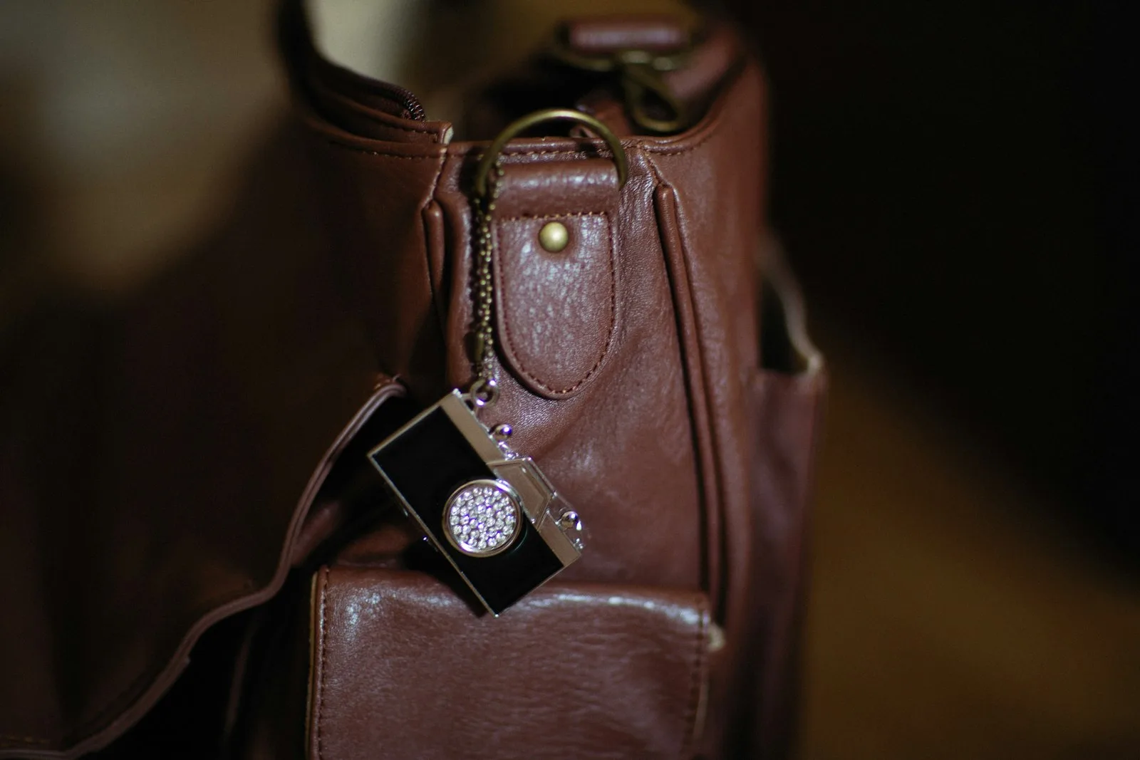 Close-up of a yellow suitcase handle with a visible travel tag and barcode
