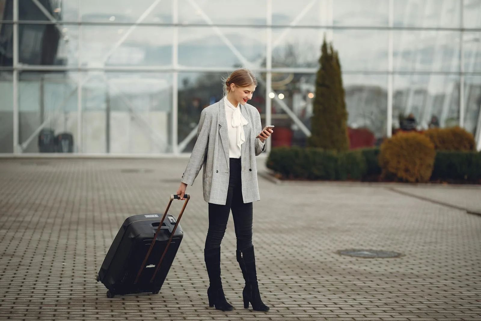 Rolling carry-on luggage in an airport terminal