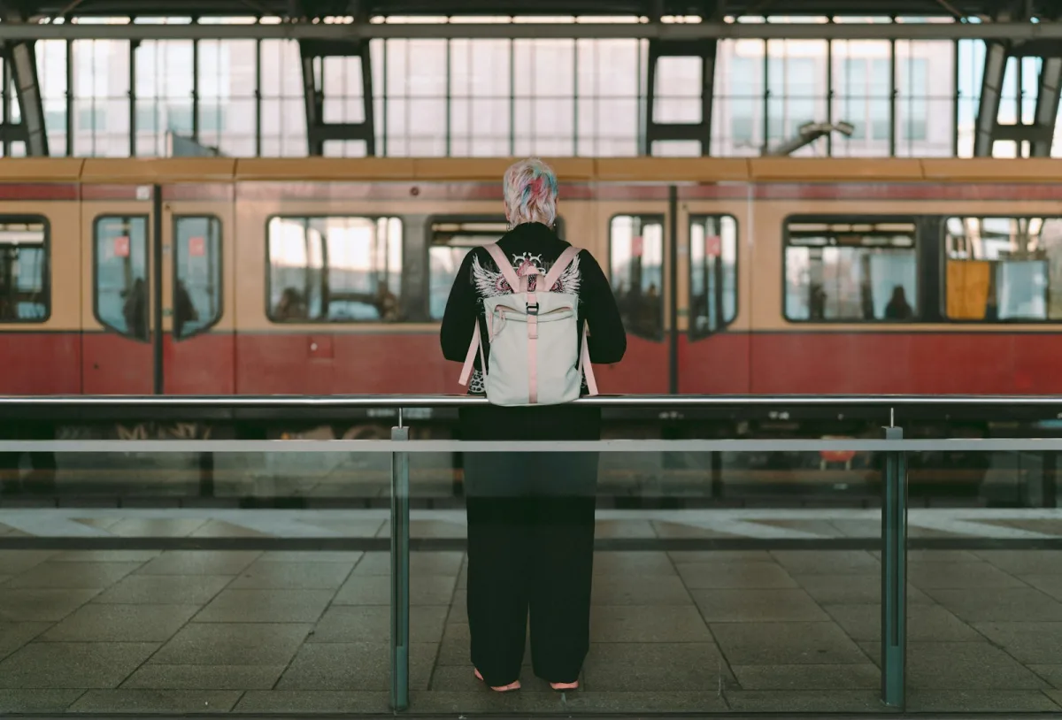 Traveller with a backpack on a city train platform