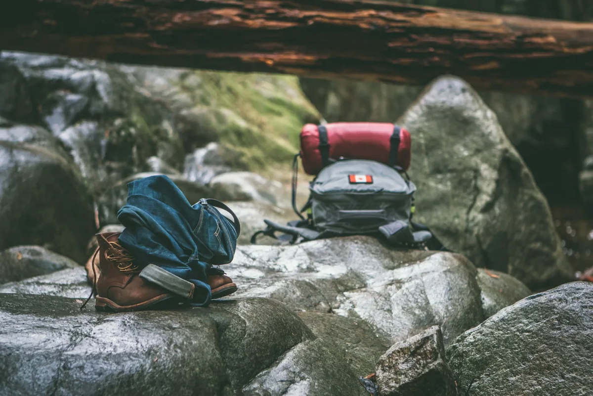 Two day packs resting on rock at a trail stop