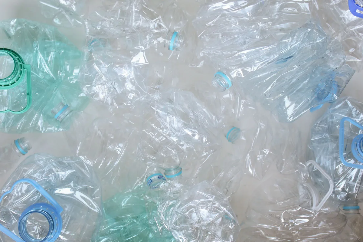 Pile of crushed clear plastic bottles